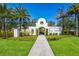 Welcoming community entrance with a Spanish-style arch and landscaping at 335 Gris Sky Ln, Bradenton, FL 34212
