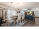 Bright dining room with a farmhouse table and open layout at 335 Gris Sky Ln, Bradenton, FL 34212