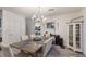Dining room features a wooden table with seating for six and a charming built-in hutch at 335 Gris Sky Ln, Bradenton, FL 34212