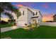 Two-story house with gray siding, white garage door, and landscaping at 335 Gris Sky Ln, Bradenton, FL 34212