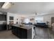 Open concept kitchen with island and living room view at 335 Gris Sky Ln, Bradenton, FL 34212