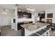 Modern kitchen with granite island and stainless steel appliances at 335 Gris Sky Ln, Bradenton, FL 34212