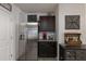 Modern kitchen with granite countertops and stainless steel appliances at 335 Gris Sky Ln, Bradenton, FL 34212