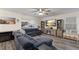 Relax in the spacious living room featuring a sectional sofa and large TV at 335 Gris Sky Ln, Bradenton, FL 34212