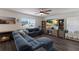 Relaxing living room with sectional sofa, large TV, and built-in shelving at 335 Gris Sky Ln, Bradenton, FL 34212