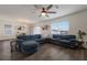 Open concept living room with sectional sofa and hardwood floors at 335 Gris Sky Ln, Bradenton, FL 34212