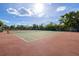 Two well-maintained tennis courts with surrounding fencing and kayak storage at 516 Lakeside Dr, Bradenton, FL 34210