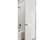 Shower with white tile and a new shower head at 7016 Foxboro Way, Nokomis, FL 34275