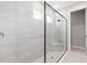 Modern bathroom featuring tiled walk-in shower with glass partition at 7016 Foxboro Way, Nokomis, FL 34275