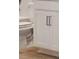 Close-up of white kitchen cabinets at 7016 Foxboro Way, Nokomis, FL 34275
