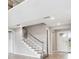 Open-concept living room with staircase and bright natural light at 7016 Foxboro Way, Nokomis, FL 34275
