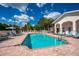 Relaxing community pool with lounge chairs at 4244 Central Sarasota Pkwy # 725, Sarasota, FL 34238