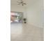 Spacious living room featuring tile floors and access to a private balcony at 4244 Central Sarasota Pkwy # 725, Sarasota, FL 34238