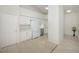 Efficient kitchen with white cabinets, stainless steel appliances, and tile floor at 4244 Central Sarasota Pkwy # 725, Sarasota, FL 34238