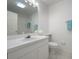 Clean bathroom with white vanity, toilet, and tiled floor at 4244 Central Sarasota Pkwy # 725, Sarasota, FL 34238