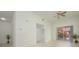 Bright living room with tile floors, sliding glass doors to balcony, and ceiling fan at 4244 Central Sarasota Pkwy # 725, Sarasota, FL 34238