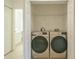 Laundry closet with washer and dryer at 4244 Central Sarasota Pkwy # 725, Sarasota, FL 34238