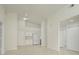 Open concept living room, kitchen, and hallway with tile flooring at 4244 Central Sarasota Pkwy # 725, Sarasota, FL 34238