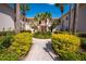 Building exterior showcasing a well-maintained courtyard with a fountain and walkway at 4244 Central Sarasota Pkwy # 725, Sarasota, FL 34238