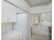 White kitchen with stainless steel appliances and ample cabinet space at 4244 Central Sarasota Pkwy # 725, Sarasota, FL 34238