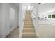 Modern light-wood staircase with metal railing at 2430 Floyd St, Sarasota, FL 34239