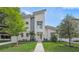 Modern two-story home with light-colored siding, landscaping, and a paved walkway at 2446 Floyd St, Sarasota, FL 34239