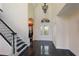 Elegant entryway with high ceilings, tile floors, grand staircase, and a decorative glass front door allowing lots of light at 8607 51St W Ave, Bradenton, FL 34210