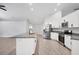 Modern kitchen with white cabinets and stainless steel appliances at 4709 Foy Pl, Sarasota, FL 34243