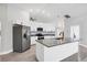 Updated kitchen featuring stainless steel appliances and an island at 4709 Foy Pl, Sarasota, FL 34243