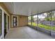 Large screened porch with access to backyard, offering ample outdoor space at 4709 Foy Pl, Sarasota, FL 34243