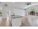 Spacious living area with tile flooring and a ceiling fan at 4709 Foy Pl, Sarasota, FL 34243