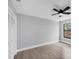 Bright bedroom with ceiling fan, large window, and neutral color palette at 4709 Foy Pl, Sarasota, FL 34243