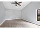 Large bedroom with tile floors and a ceiling fan at 4709 Foy Pl, Sarasota, FL 34243