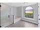 Spa-like bathroom featuring a large shower, soaking tub, and arched window at 4709 Foy Pl, Sarasota, FL 34243