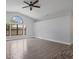 Bright living room showcasing tile floors and large windows at 4709 Foy Pl, Sarasota, FL 34243