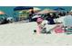 Beach scene with playing in sand; nearby beachgoers and lifeguard at 191 Palm Air Dr, Osprey, FL 34229
