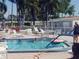 Refreshing community pool with ample seating and a fun atmosphere at 191 Palm Air Dr, Osprey, FL 34229