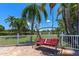 Relaxing patio with seating area and view of green space at 191 Palm Air Dr, Osprey, FL 34229