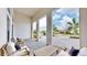 Covered patio with seating area overlooking the street at 8980 Artisan Way, Sarasota, FL 34240