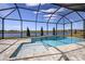 Resort style screened-in pool with lake view at 725 Anegada Ln, Sarasota, FL 34234