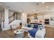Bright living room with comfy sofa and view of kitchen at 725 Anegada Ln, Sarasota, FL 34234