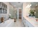 Luxurious bathroom with soaking tub, walk-in shower, and dual vanities at 725 Anegada Ln, Sarasota, FL 34234
