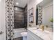 Clean bathroom with dark tile and modern finishes at 725 Anegada Ln, Sarasota, FL 34234