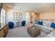 Open concept bonus room with comfortable seating at 725 Anegada Ln, Sarasota, FL 34234