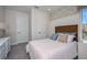 Bright bedroom with a comfortable bed and stylish decor at 725 Anegada Ln, Sarasota, FL 34234