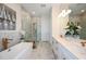 Luxurious bathroom with soaking tub, walk-in shower, and dual vanities at 725 Anegada Ln, Sarasota, FL 34234