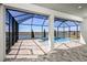 Relaxing screened-in pool with lake views at 725 Anegada Ln, Sarasota, FL 34234