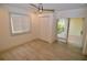 Bedroom featuring wood-look floors, sliding glass doors to a patio, and a closet at 6101 34Th W St # 1E, Bradenton, FL 34210