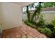 Stone pathway through a garden with lush plants at 6101 34Th W St # 1E, Bradenton, FL 34210
