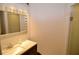 Bathroom boasts a vanity with modern finishes and a large mirror at 6101 34Th W St # 1E, Bradenton, FL 34210